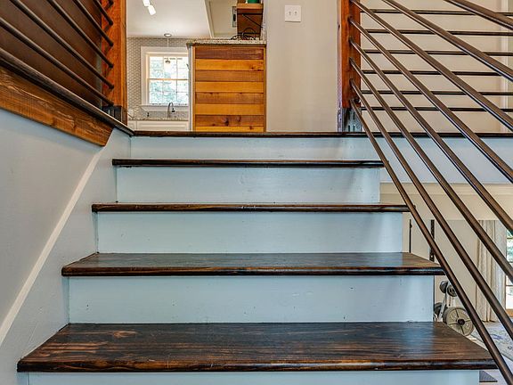 Split level entrance with modern accent railing.