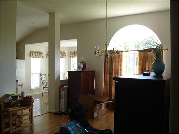  Notice the high ceiling and brightness of this formal dining room.