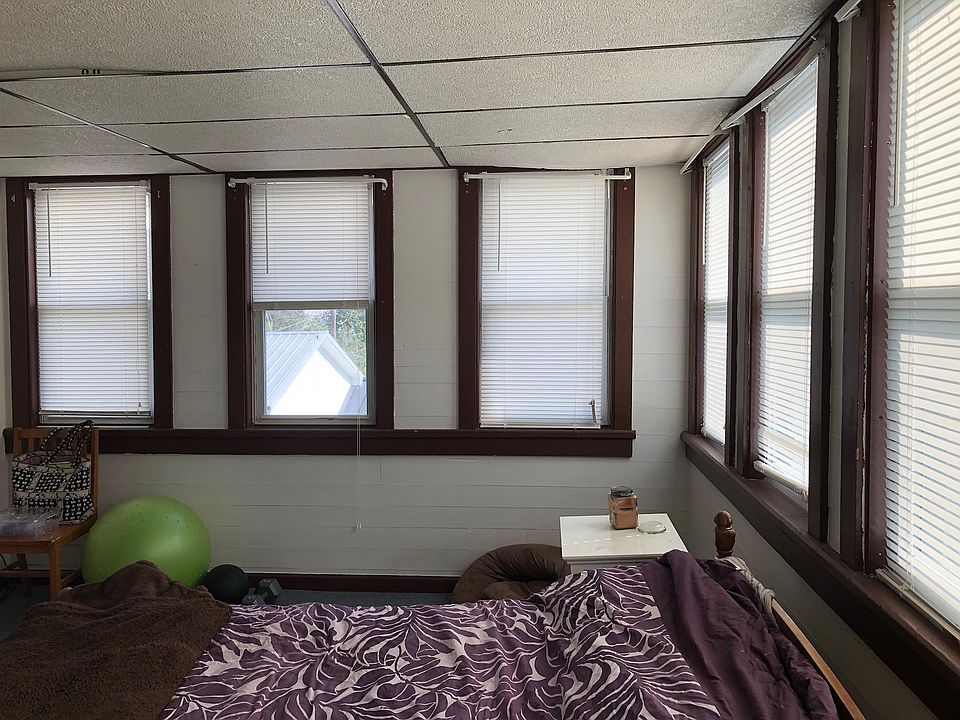 Large bedroom with windows galore.