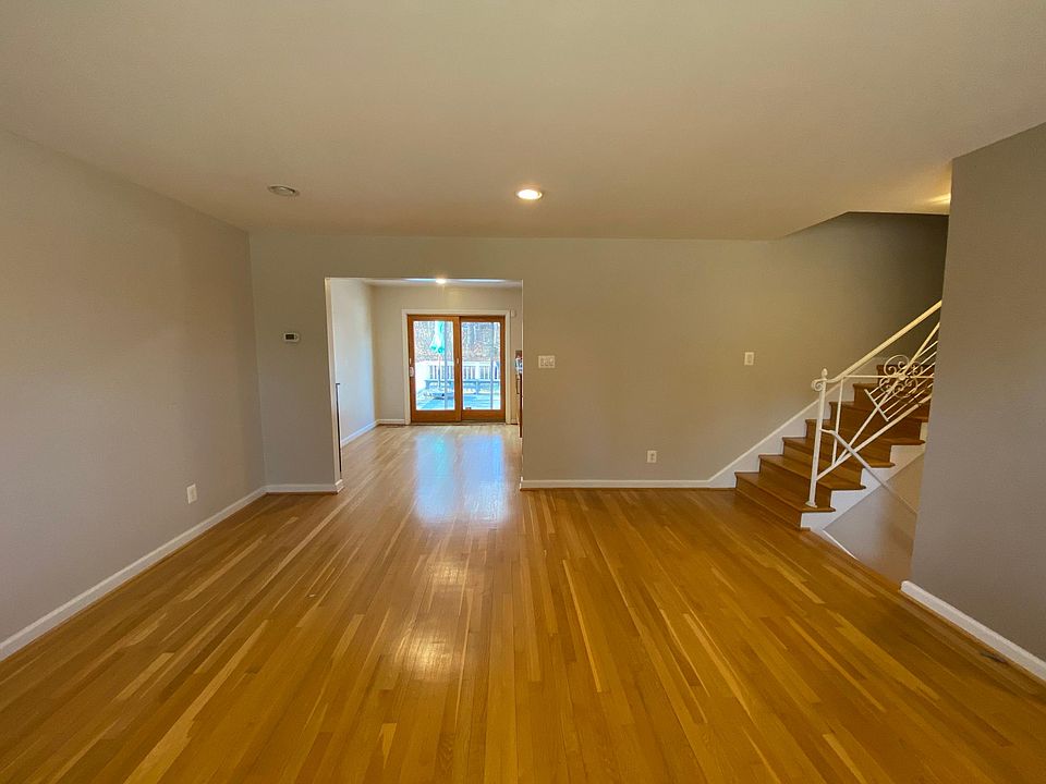 living room looking into dining room and back deck