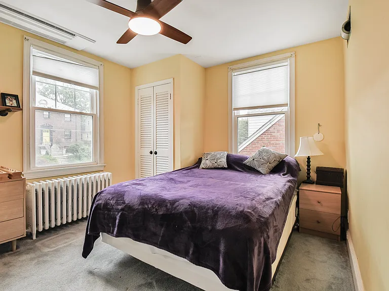 Southeast bedroom from entry door. Mini-split ceiling mounted HVAC unit for heating/cooling.