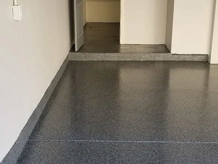 Custom under stairs storage closet with light and electrical outlet.