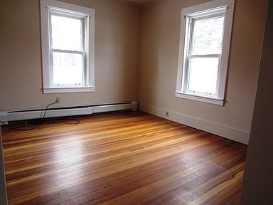 Bedroom 1 w/ wood flooring