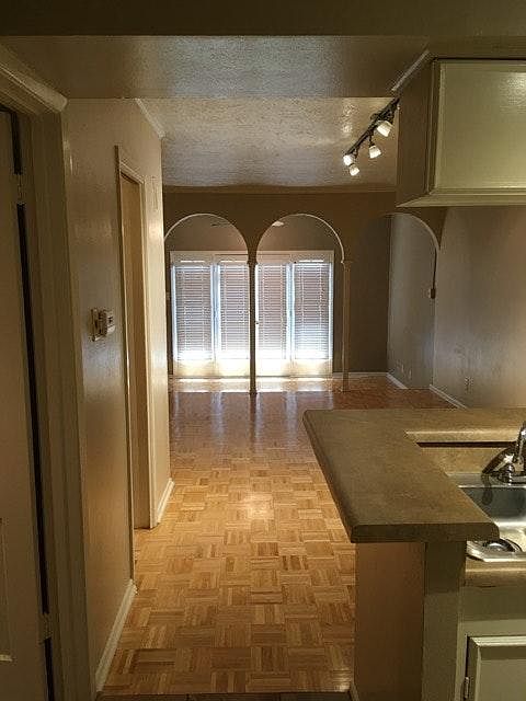 View as you walk into condo. Bathroom is 1st door on left an