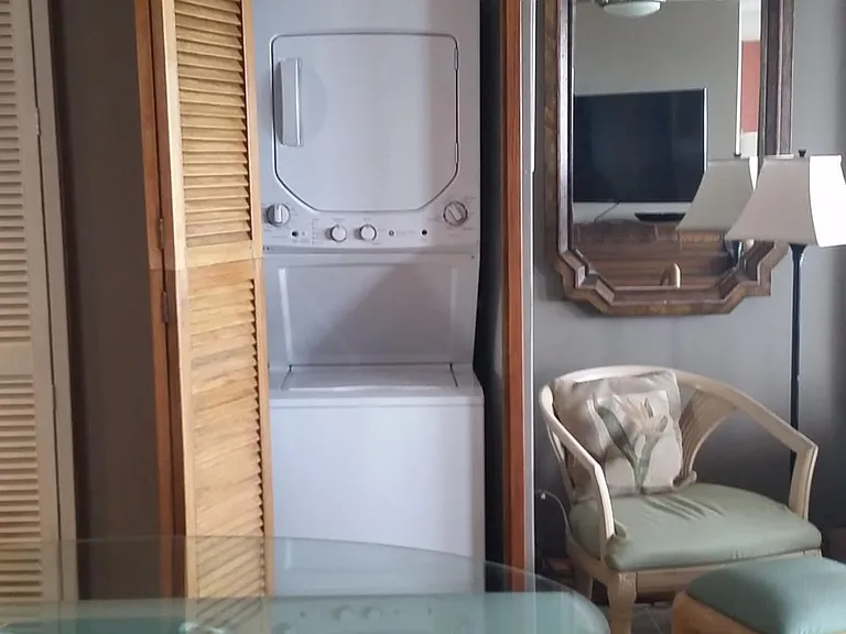 Laundry center in the condo, with initial laundry supplies.