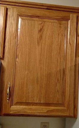 Raised panel oak cabinets and plenty of counter space make this an ideal kitchen. 1/2  bath located as you enter from the garage.