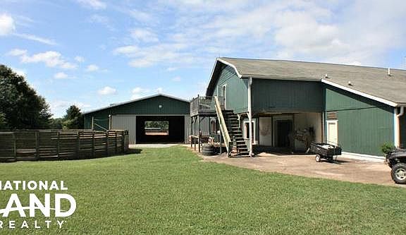 Show barn and indoor arena in the background