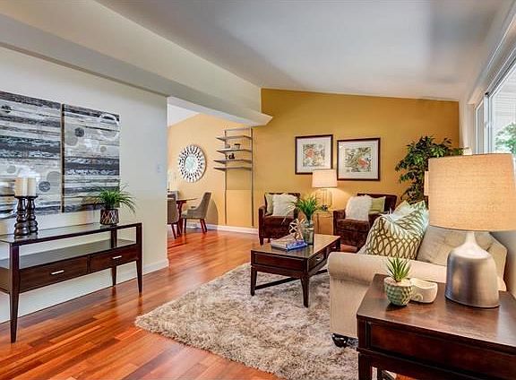Newly refinished wood floors anchor the open floor plan.