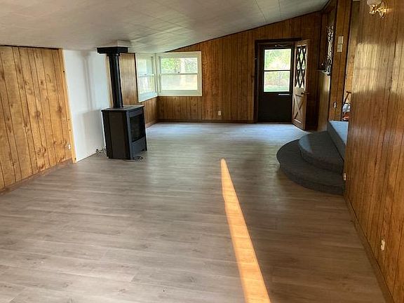 living room with new flooring and gas fireplace