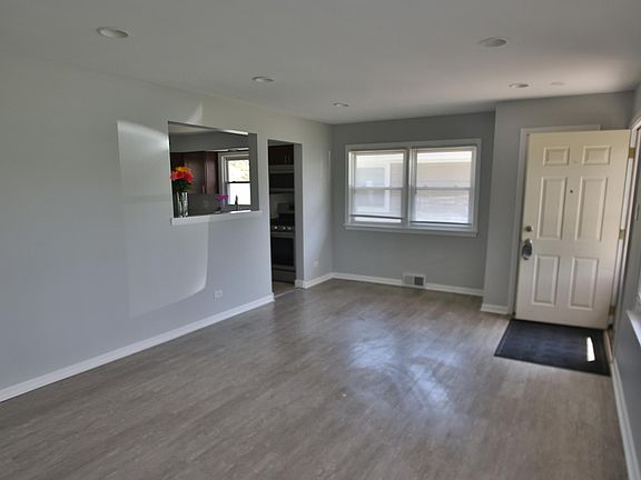 Spacious living room with brand new opening toward kitchen