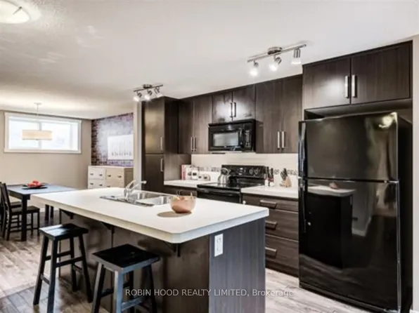 517 McKenzie Towne Close S #100, Calgary, AB T2Z 1A7