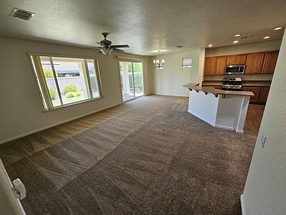 Large living area with adjoining dinning area. All new carpet and paint.