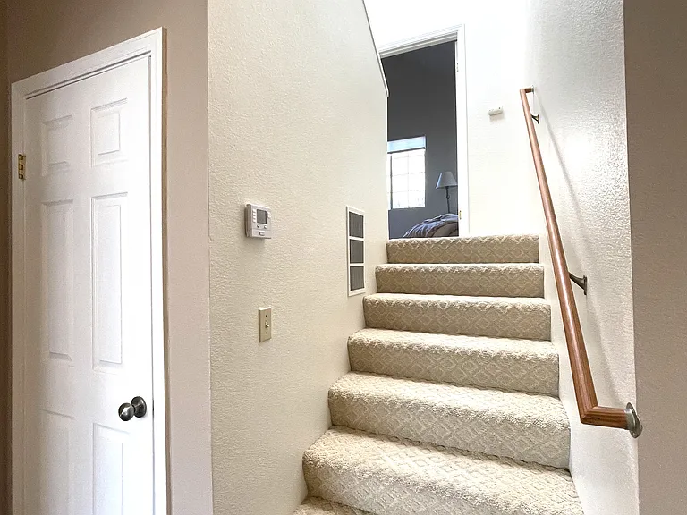 Guest closet and stairs to Master bedroom