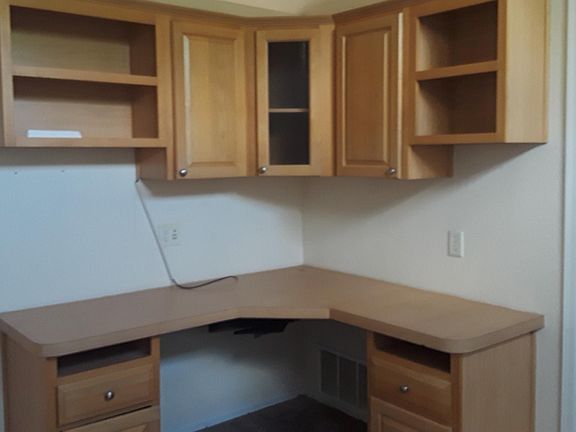 Built in desk and book shelves in office