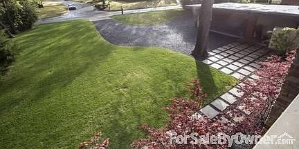 Front Yard from Second Story Balcony
						:
						View of front yard and driveway from second story balcony