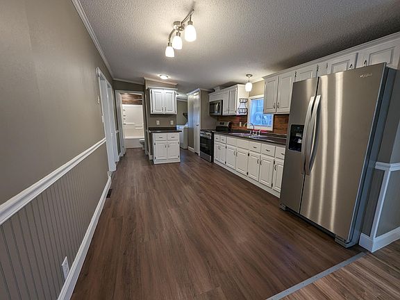 Open concept Kitchen leading to mud room
