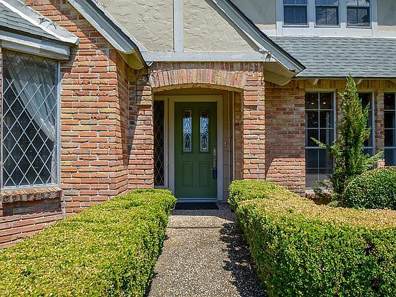 Curb appeal galore! Immaculate landscaping gives this charming home a welcoming feel from the moment you arrive.