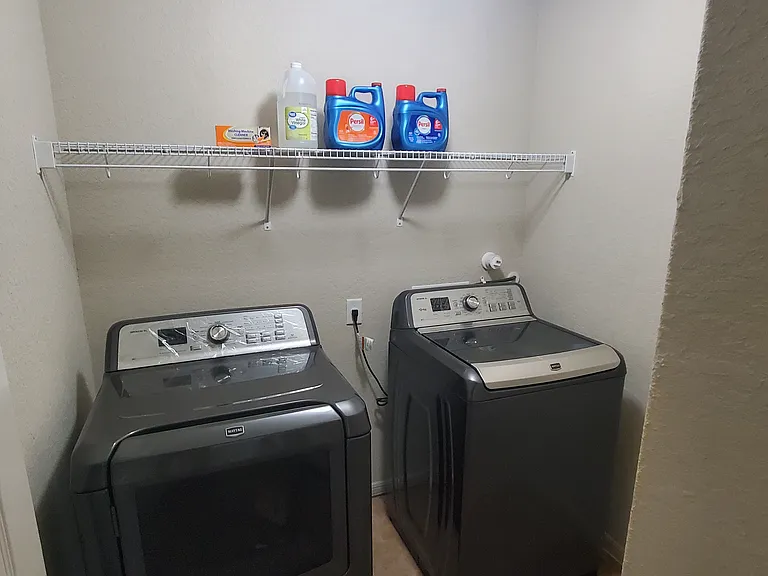 Utility room with washer/ dryer