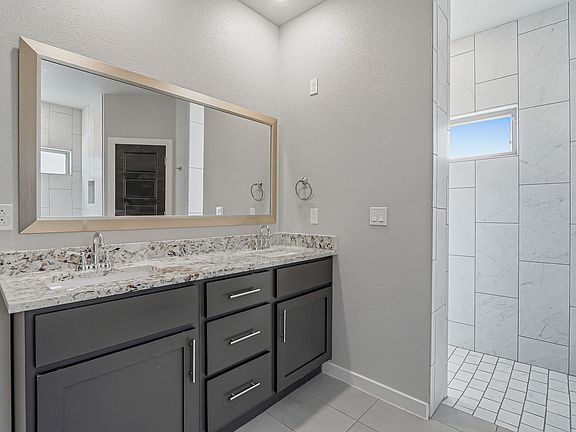 Hardwood Vanity with granite countertops and double vanity - Open Walk-in Shower