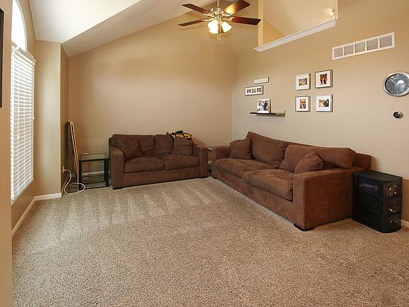 Front Living Room - Blinds on the windows, Ceiling Fan with 
