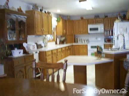 Sit Down For A Nice Meal : kitchen and dinning room (new wood laminate floor will be installed soon)
