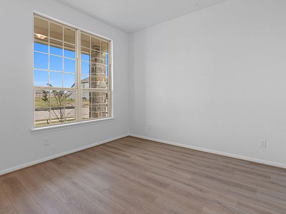 Versatile flex space at the front of the home-perfect for an office, dining room, or playroom.