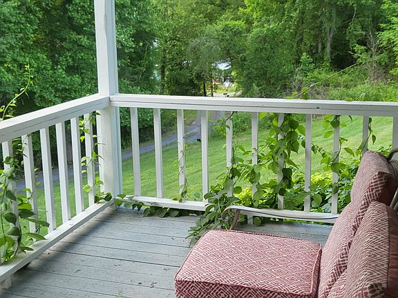 Front porch overlooking your private road along a line trees