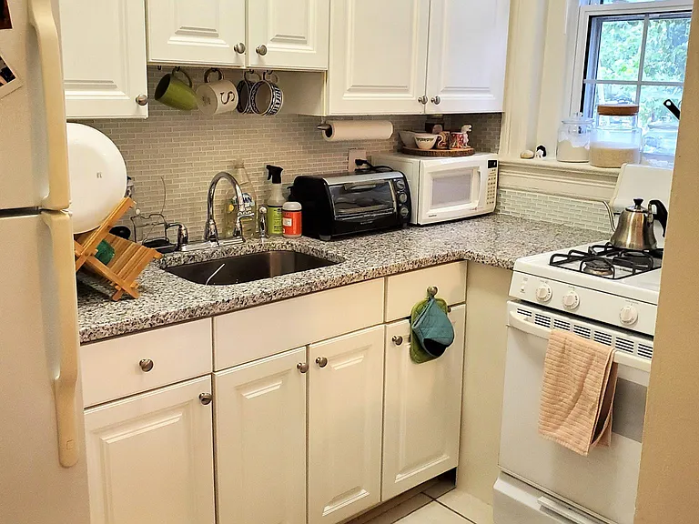 Granite counters, glass tile backsplash and full size gas range.
