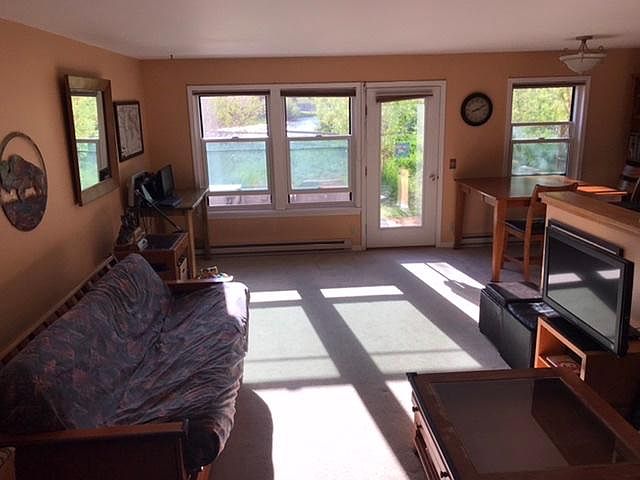 Bright, open living room w/view of Flat Creek