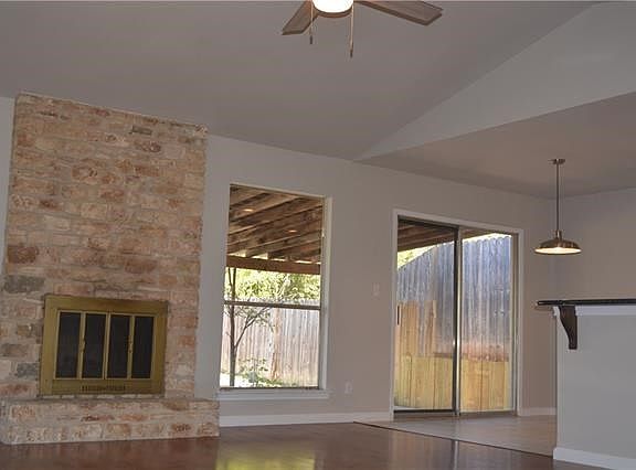 The vaulted ceiling, fresh 2-tone paint & gleaming wood floors make the great room bright & inviting