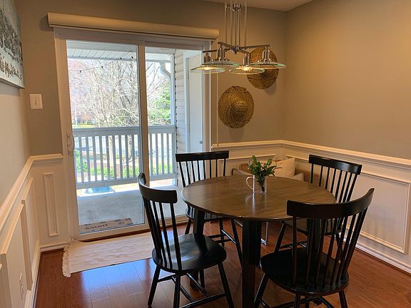 Dining area with wainscoting and balcony