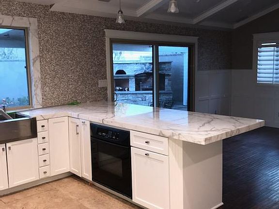 Family room and outside patio view from kitchen. Great house for family gatherings.