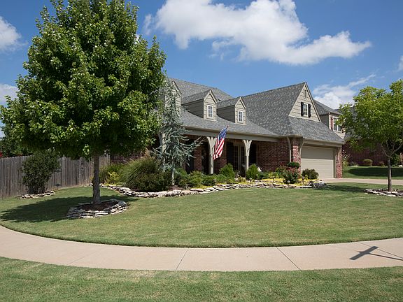 Dormer windows and wood shutters add to the architectural charm of this well appointed home with unparalleled curb appeal, neighborhood sidewalks and oversized driveway.