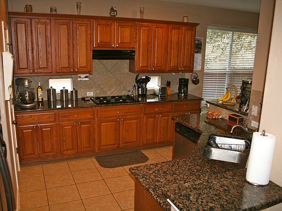 Spacious kitchen with built in dish washer and garbage dispo