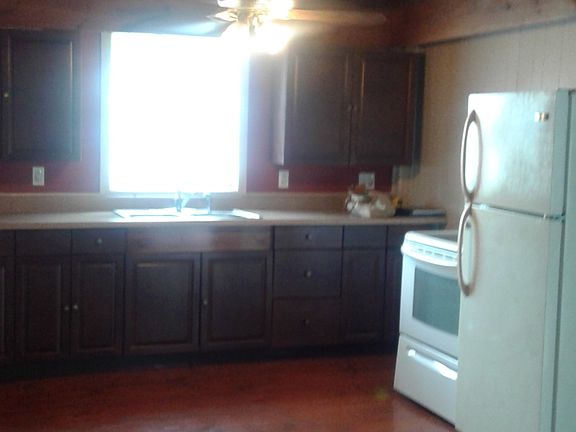 21x 11 Kitchen. wide pine floors, ceiling fans, fridge and s