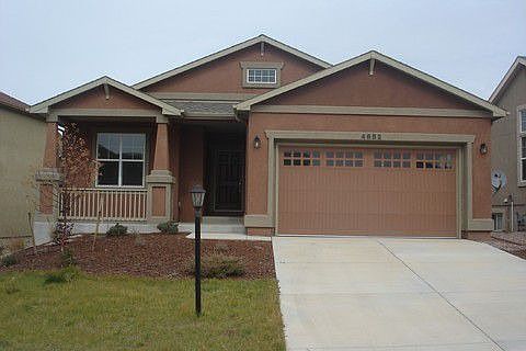 Front view Stucco landscaped front and back