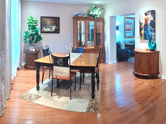 Large Dining Room with a table comfortably seats 8 people.