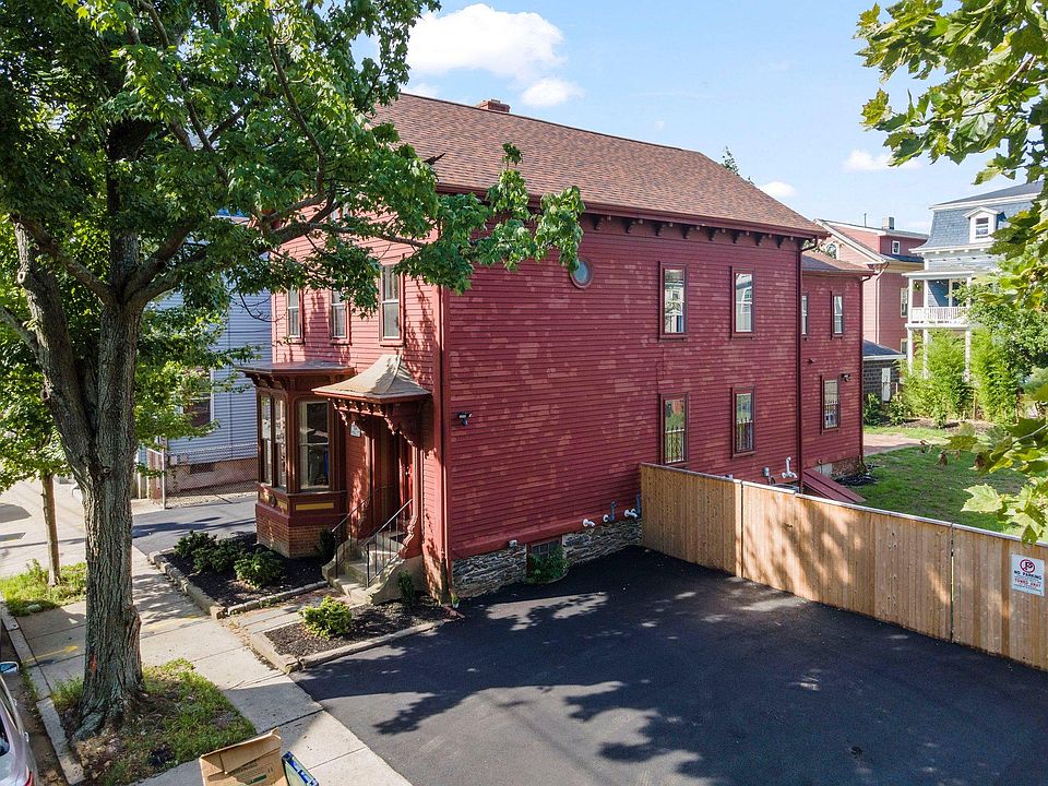 Side view showing parking and fenced yard