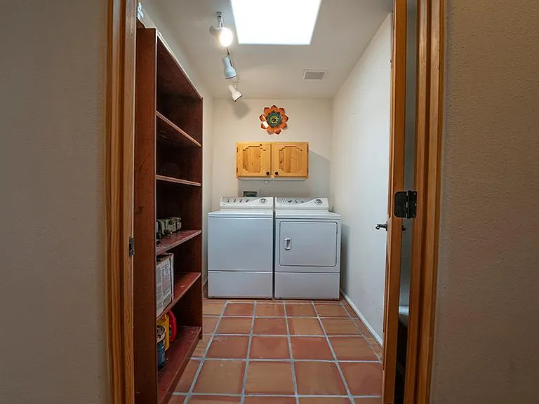 Commercial laundry washer and dryer with skylight