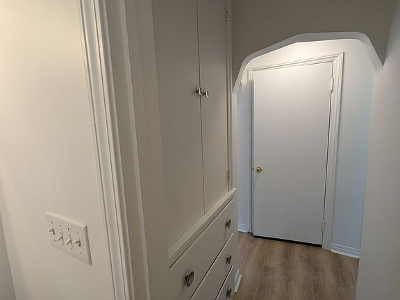 The area is outside the bath for towel, sheets and bath storage.