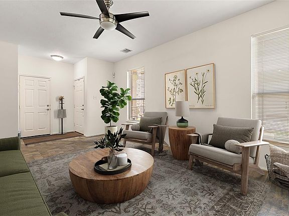 Charming and cozy living room perfect for relaxation in this beautifully designed condo.