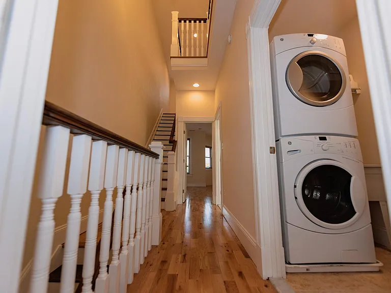 Laundry room with full-sized washer and dryer