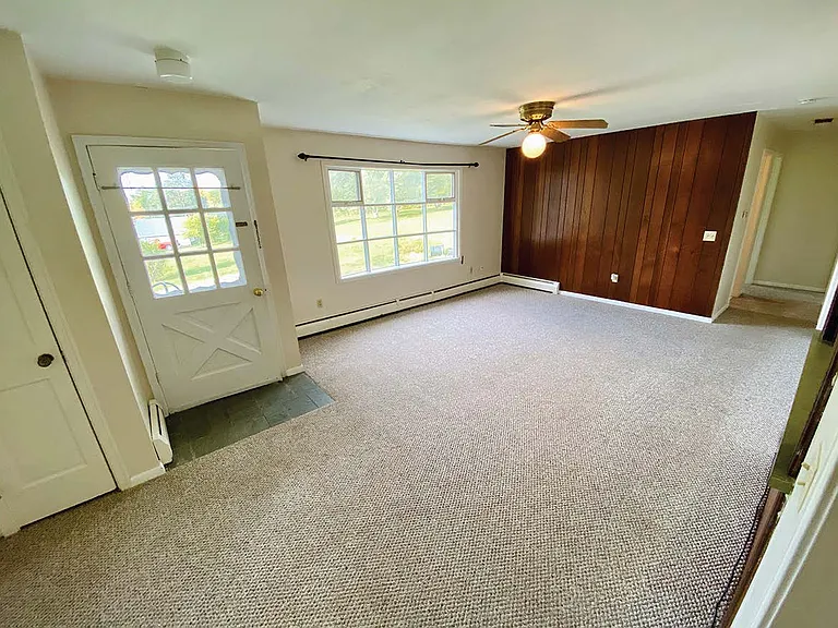 Large, bright living room with additional dining area