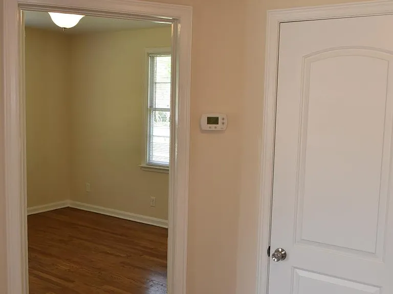 Hall: Linen closet, digital thermostat, refinished floors
