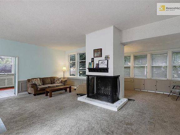 Unique 3-sided Fireplace Defines This Space