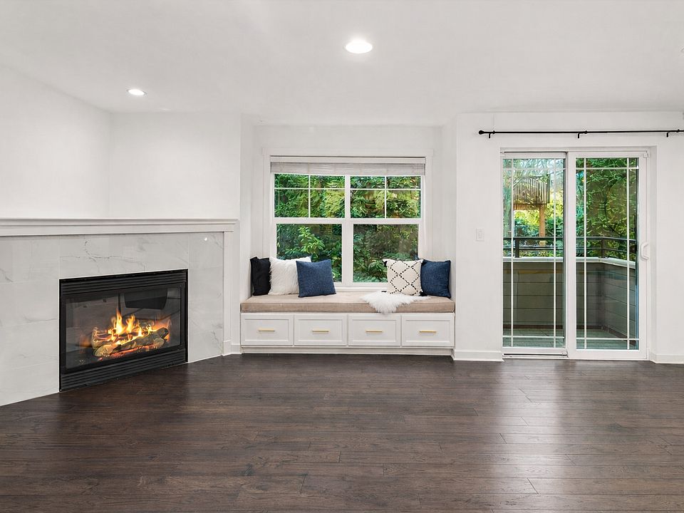 Living room with cozy reading nook and outdoor balcony