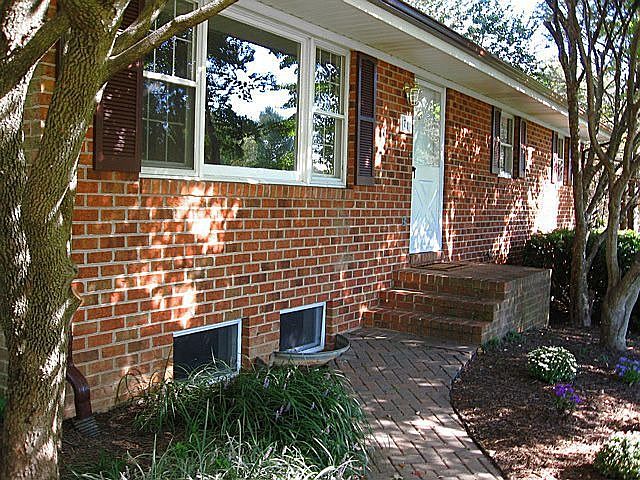 Mature landscaping, brick walkway