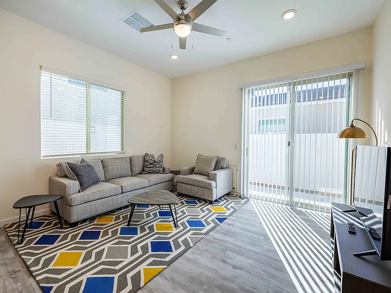 Experience the comfort of this bright and airy living space, perfect for relaxation.