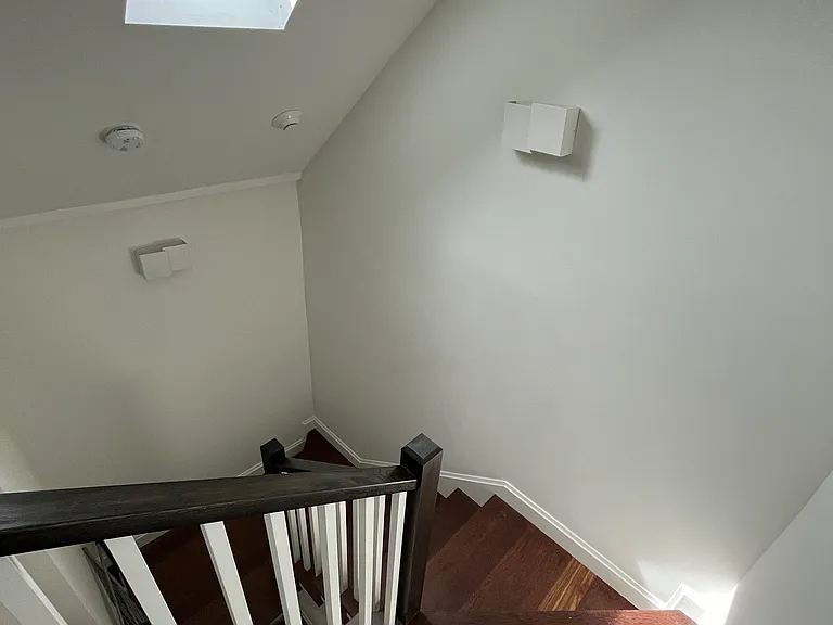 Another view of stairs to master suite. Skylight opens by remote control.