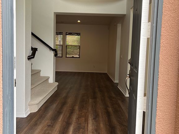 Grand entrance. Straight ahead the family room, to the immediate left the formal dining room, to the immediate left the formal living room, and t the far right the hallway to the first floor bedroom and bathroom